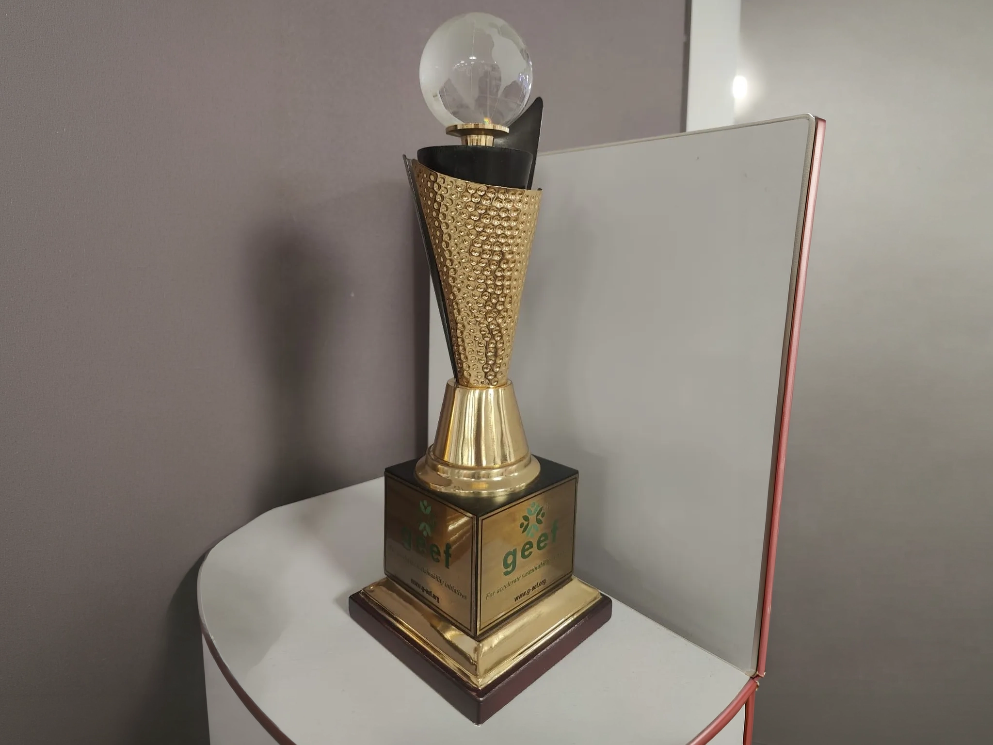 Golden GEEF Global CSR Award trophy.