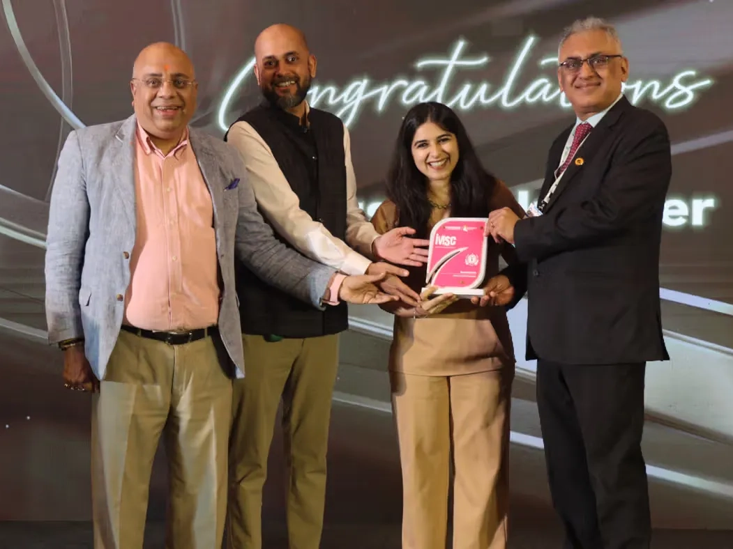 Glass and metal I M S C award trophy.