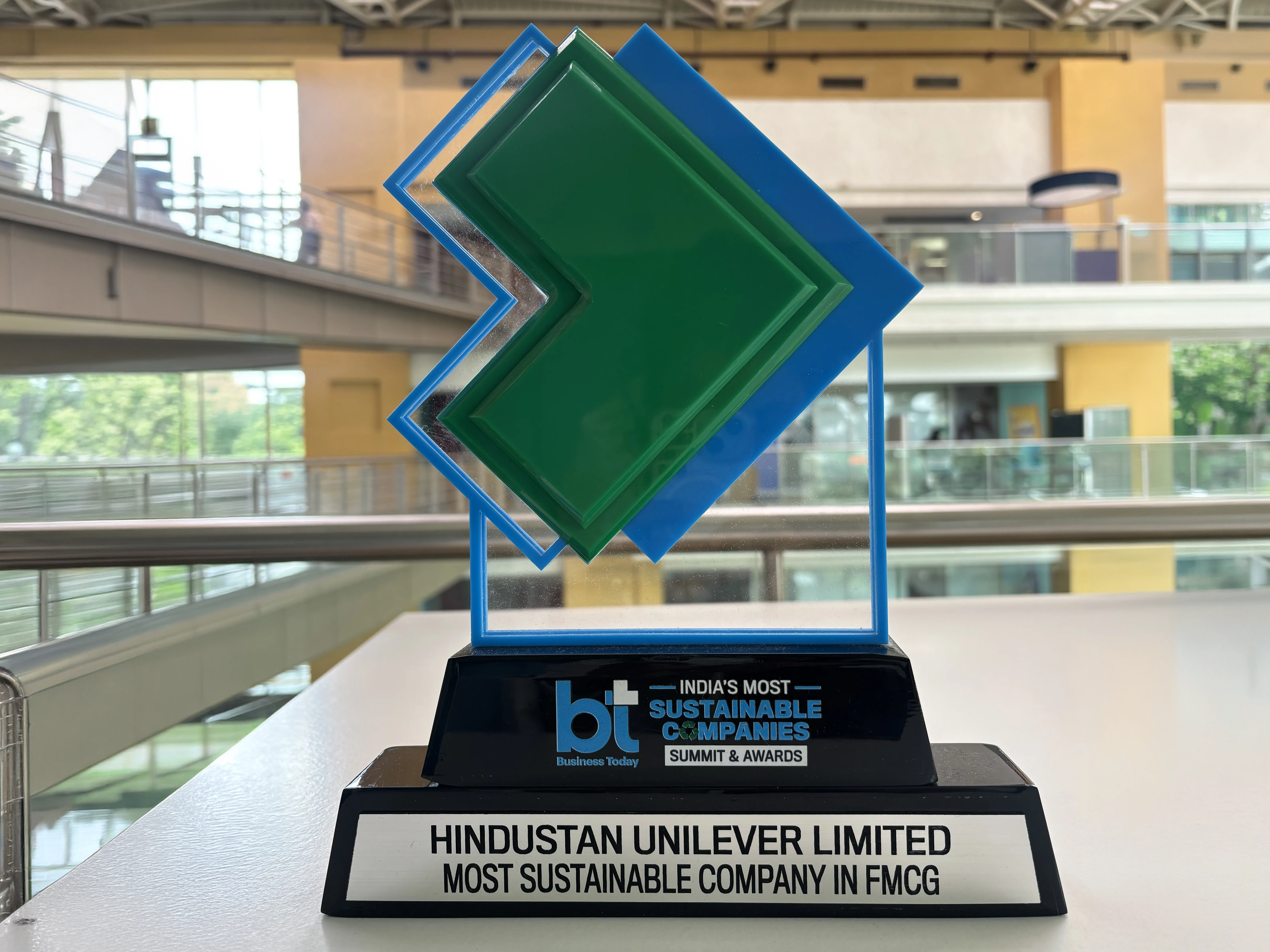Blue and clear glass Business Today award trophy.