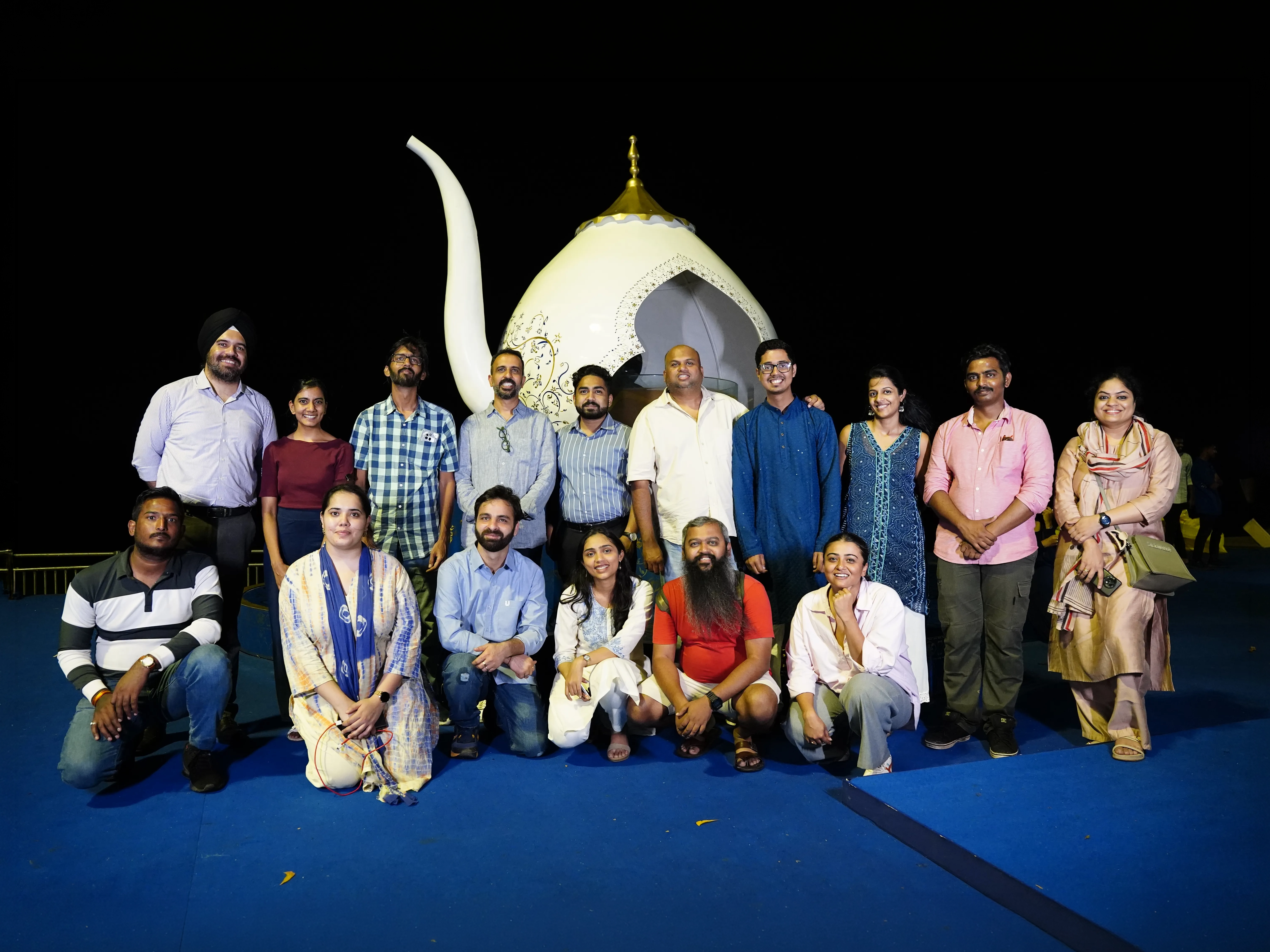Large group of people posing together to celebrate the Cannes win.