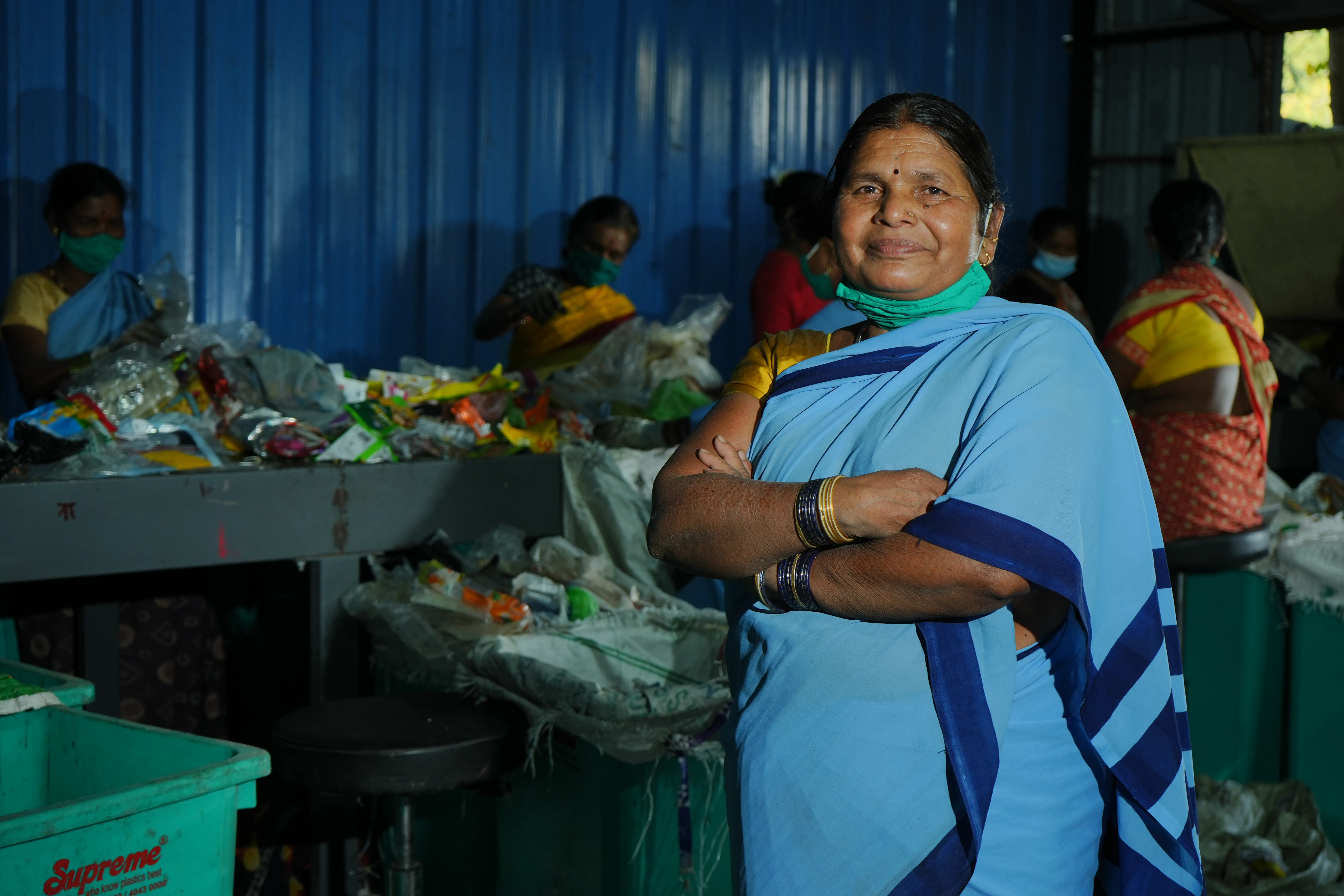 Workers sorting plastic materials for circular lifecycle recycling